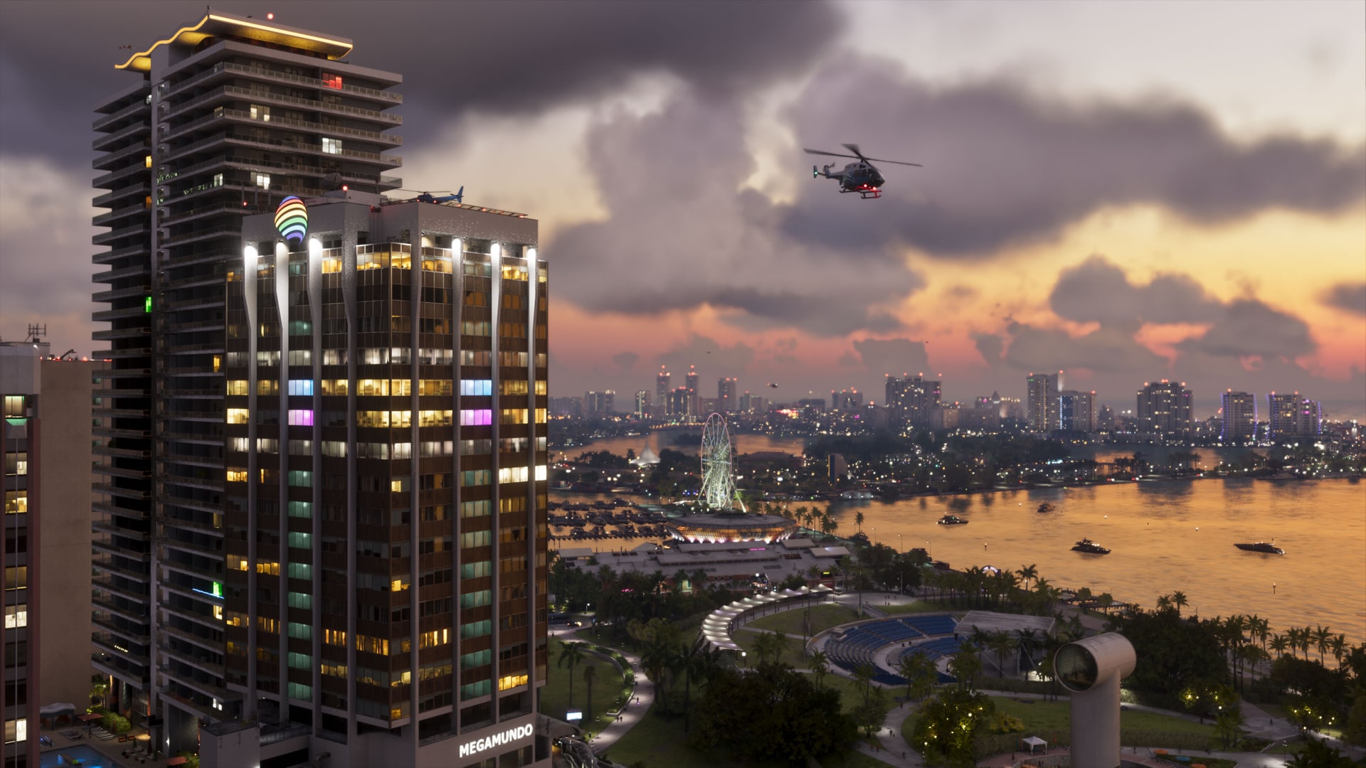A high-rise with lit windows above Vice City’s bay at dusk, a helicopter passing overhead, in an official Grand Theft Auto VI screenshot